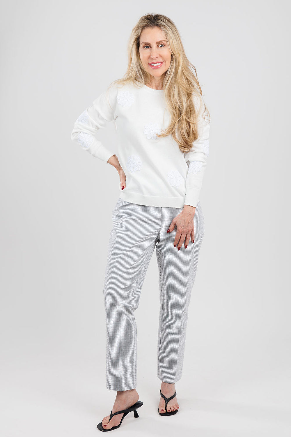 J Society Embroidered Flower Sweater in White paired with Peace of Cloth Joey Pull-On Crop Jeans in Black available at Barbara Katz