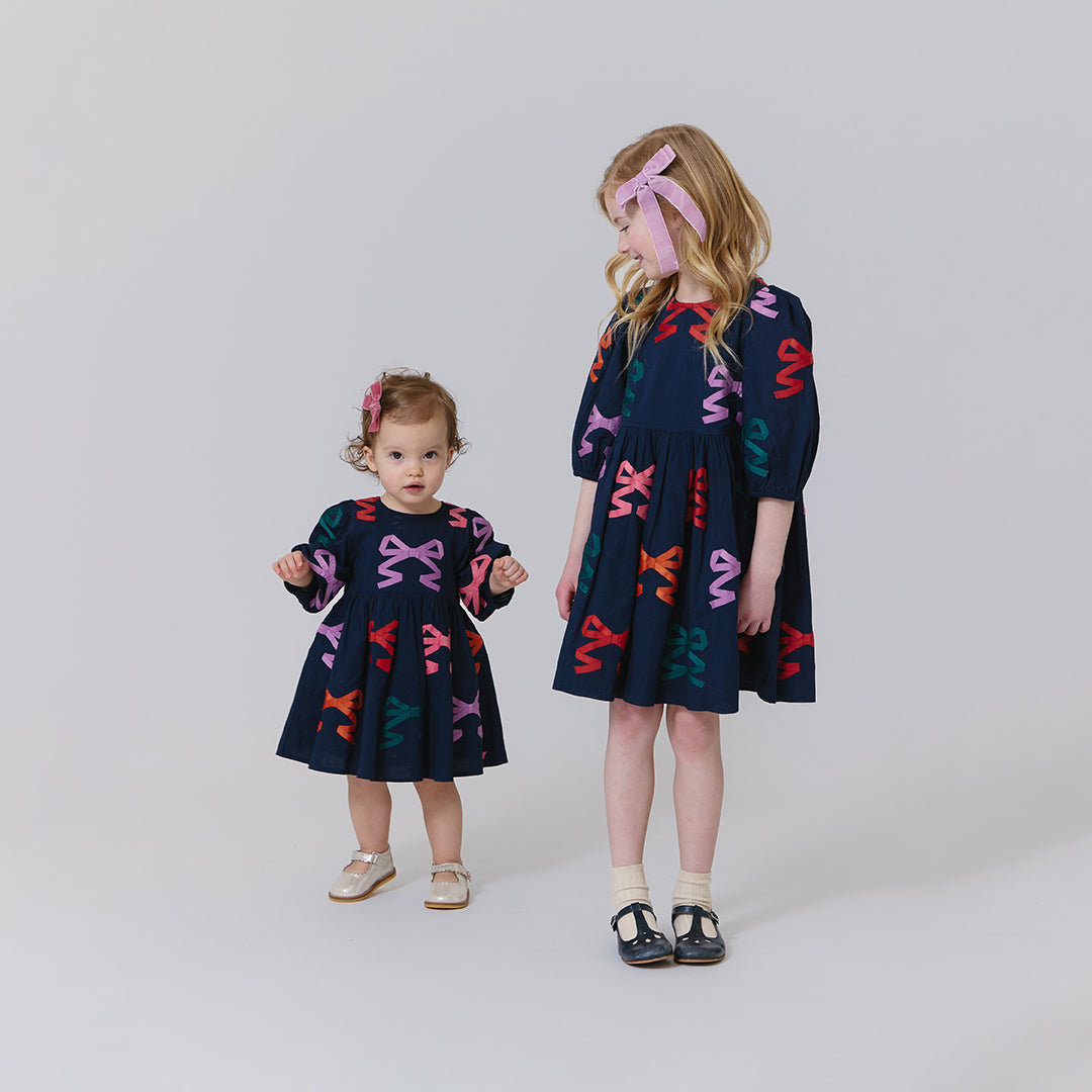 Pink Chicken Girls Brooke Dress in Multi Bow Applique available at Barbara Katz