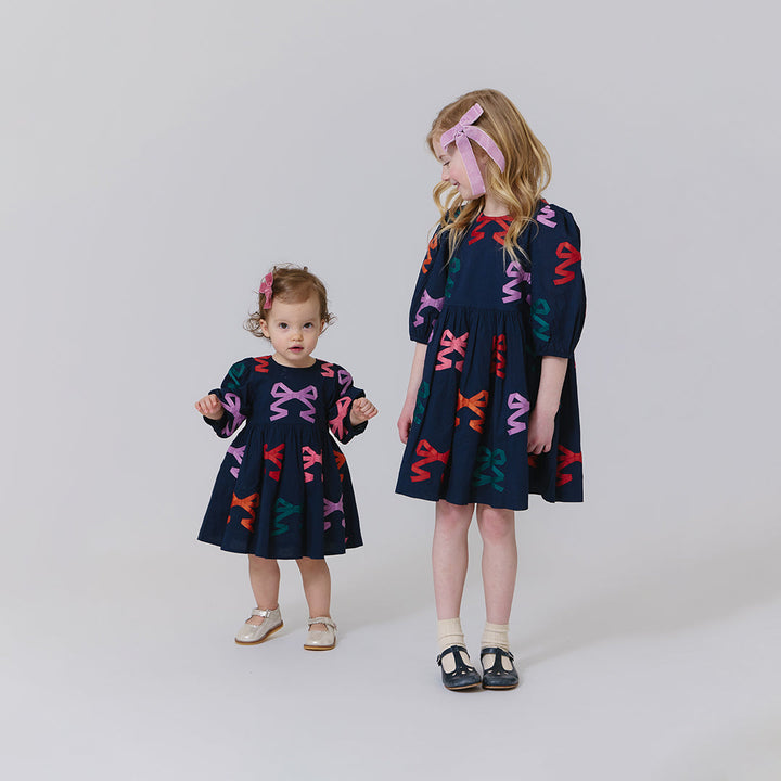 Pink Chicken Girls Brooke Dress in Multi Bow Applique available at Barbara Katz