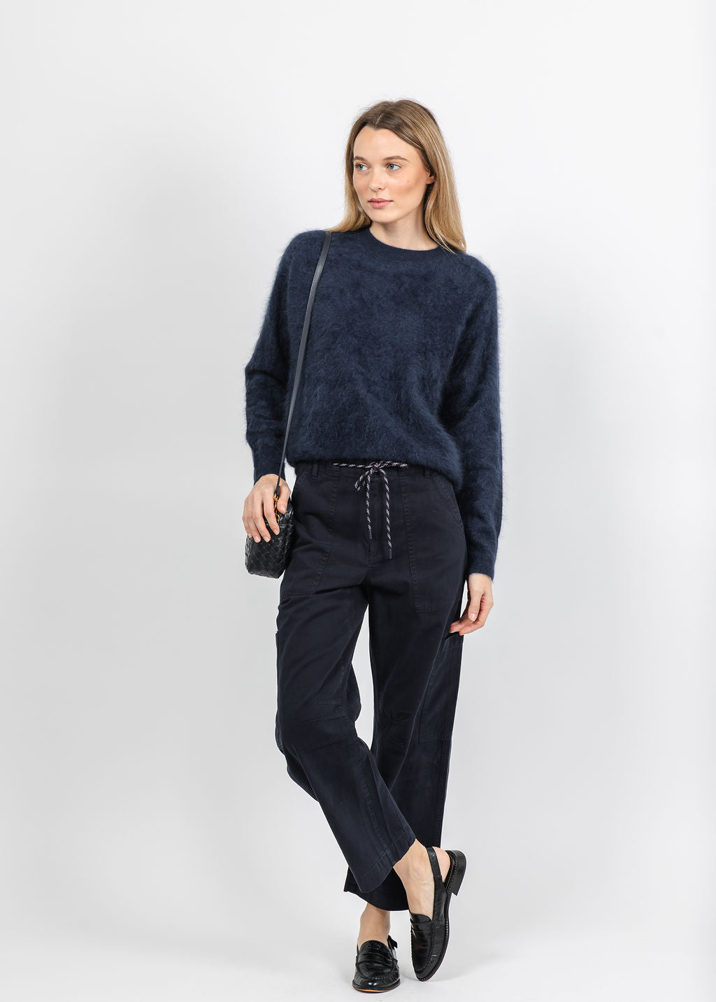 Autumn Cashmere Relaxed Fit Saddle Crew Sweater With Back Yoke in Navy paired with Pistola Sabrina Curved Utility Pants in Nautical available at Barbara Katz