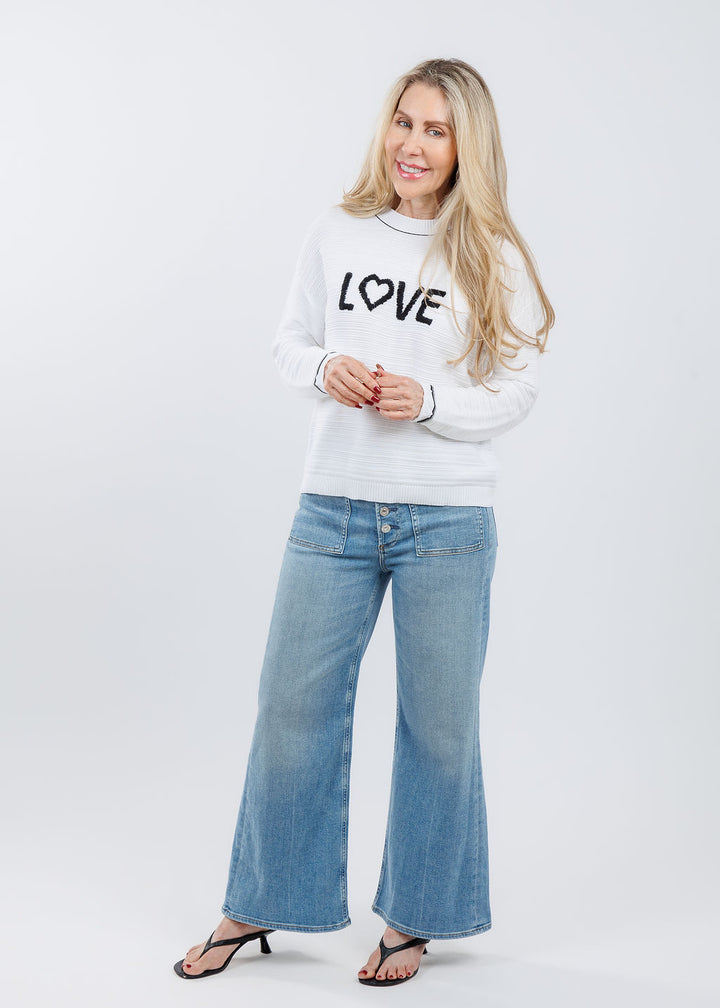 Pure Amici Love Crew Neck Sweater in White/Black paired with Citizens of Humanity Lyra Patch Pocket Jeans in White available at Barbara Katz
