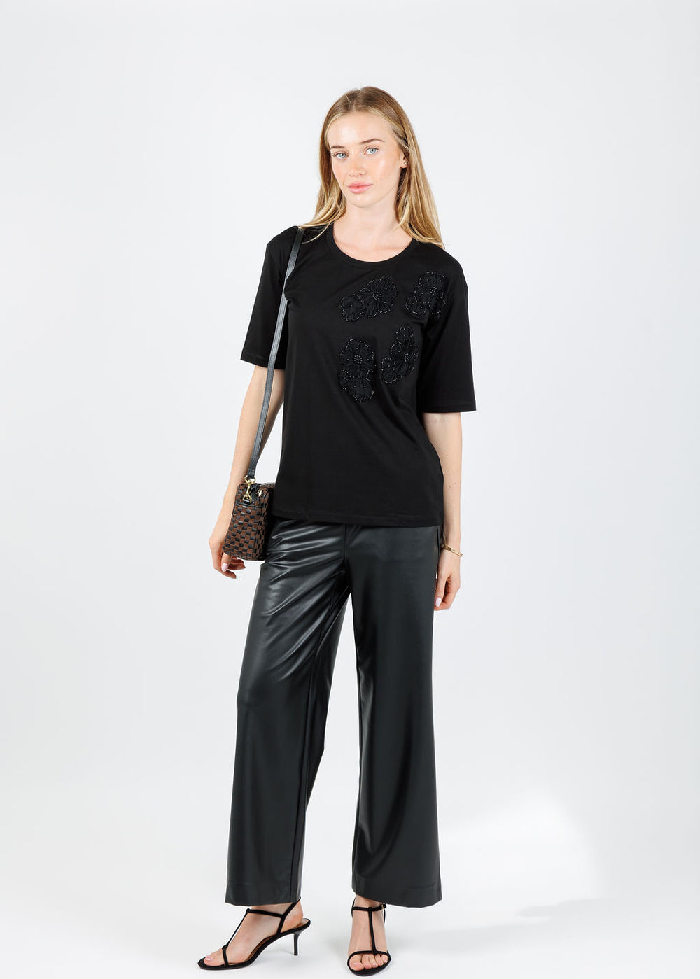 Leo & Ugo Ines Floral Bead Detail Short Sleeve Tee in Black paired with Raffaello Rossi Palina Vegan Leather 6/8 Culotte Pants in Black available at Barbara Katz