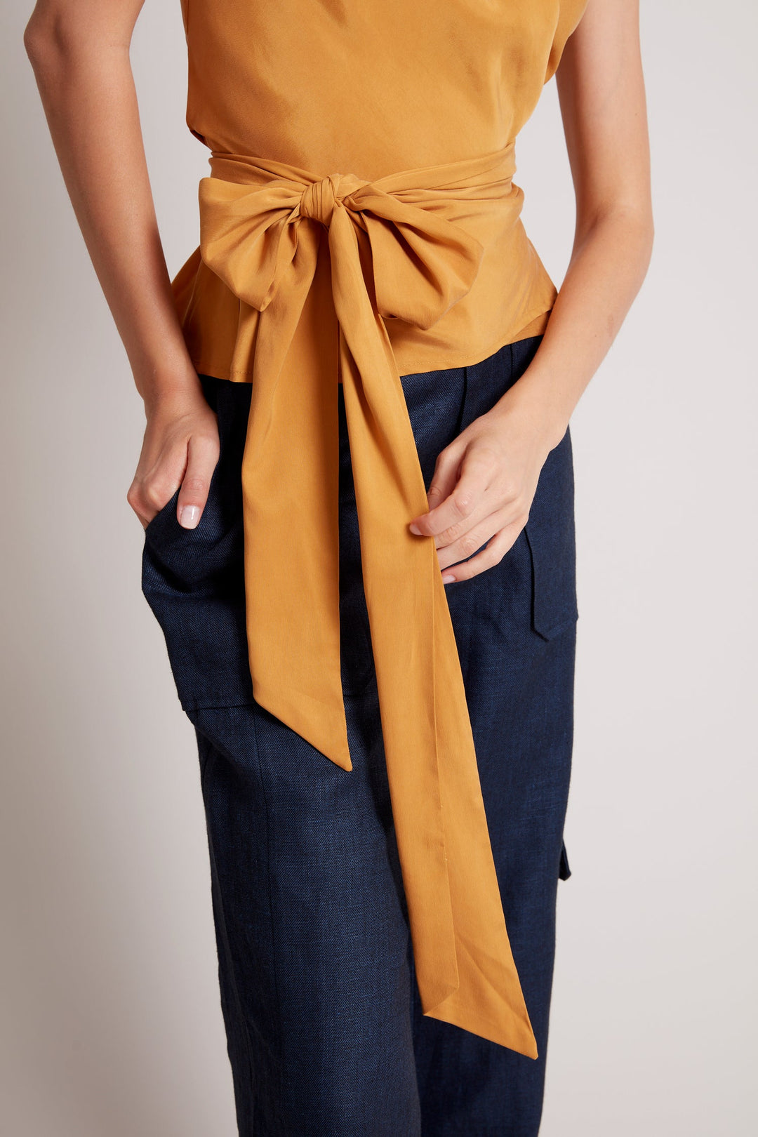 Adroit Atelier Remi Sleeveless Wrap Top in Sunshine available at Barbara Katz