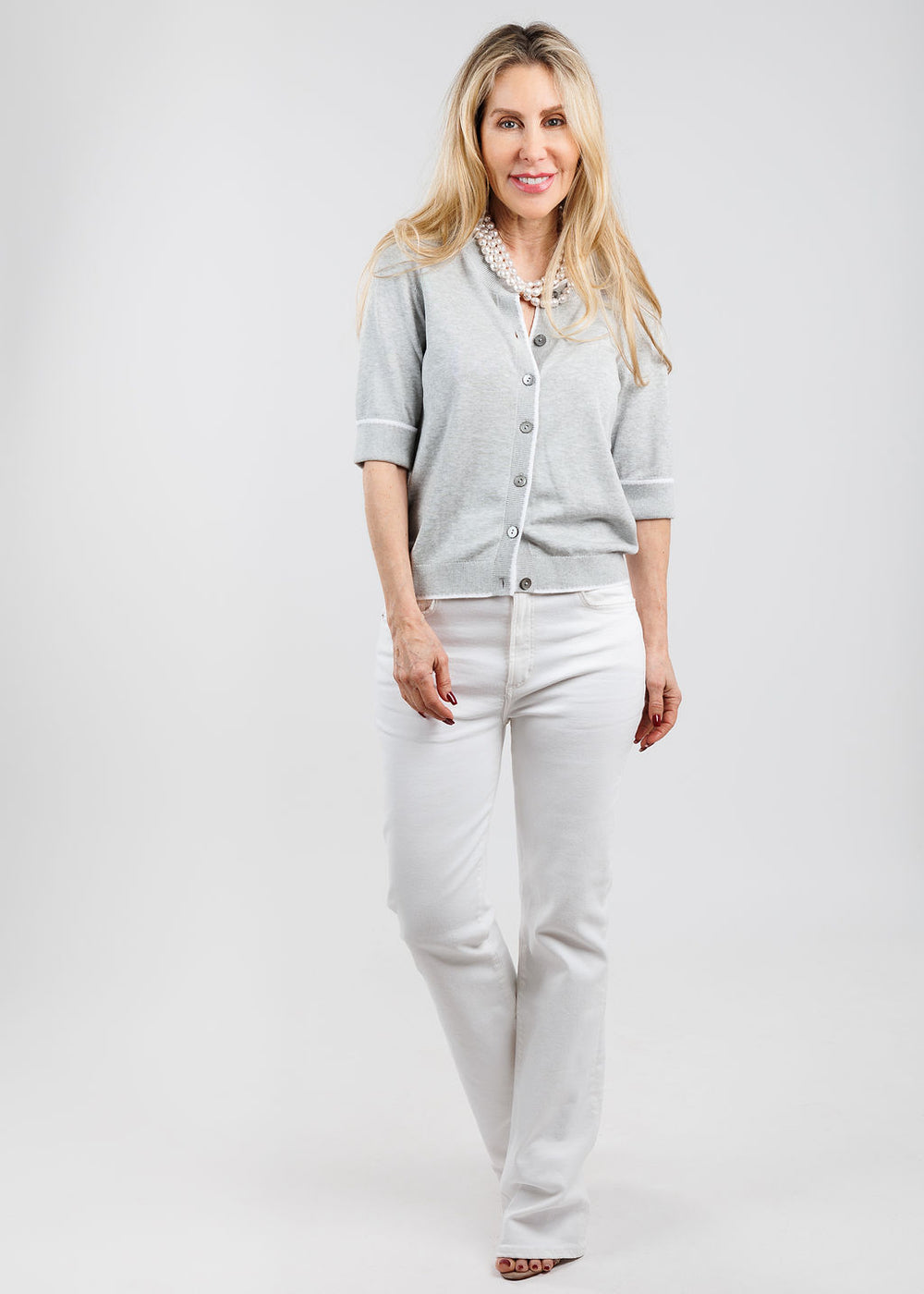 Repeat Short Sleeve Cardigan With Contrast Seams in Soft Grey paired with Frame Le Slim Palazzo Jeans in White available at Barbara Katz