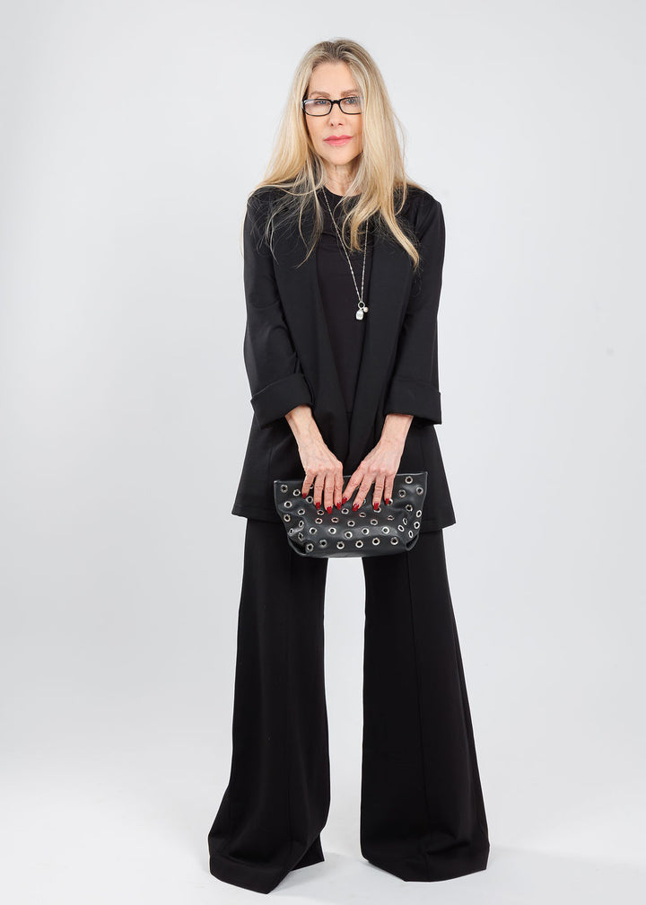 Ripley Rader Ponte Knit Short Sleeve Top & Oversized Blazer in Black paired with matching Ponte Knit Wide Leg Pants, Chan Luu Mona White Pearl Drop Silver Necklace, B-Low the Belt Gia Grommet Clutch Bag in Black Silver, available at Barbara Katz