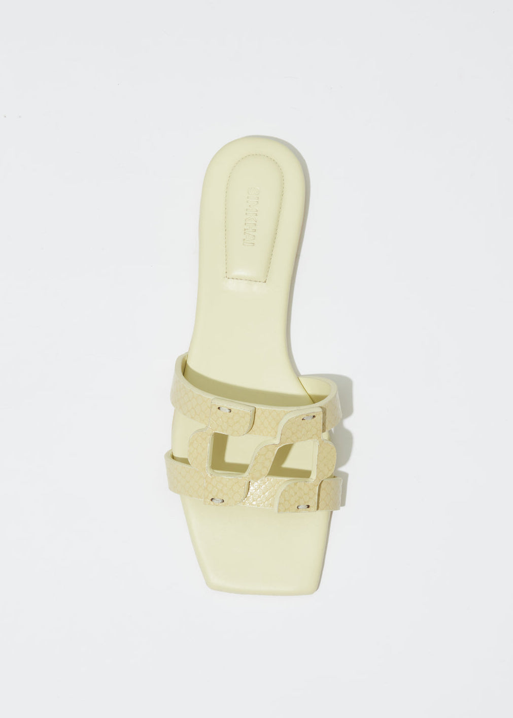 Simkhai Simkhai Monogram Snake Leather Flat Slide in Pistachio available at Barbara Katz