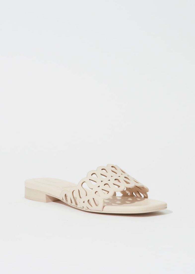 Simkhai Mccall Laser-Cut Leather Flat Slide in Cream available at Barbara Katz