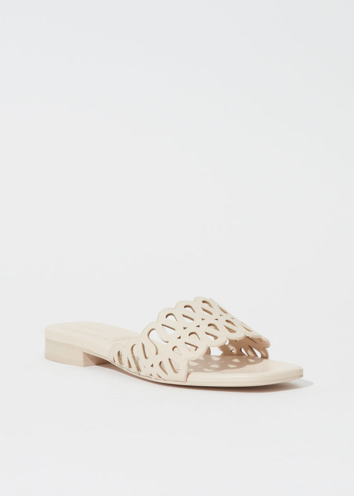 Simkhai Mccall Laser-Cut Leather Flat Slide in Cream available at Barbara Katz