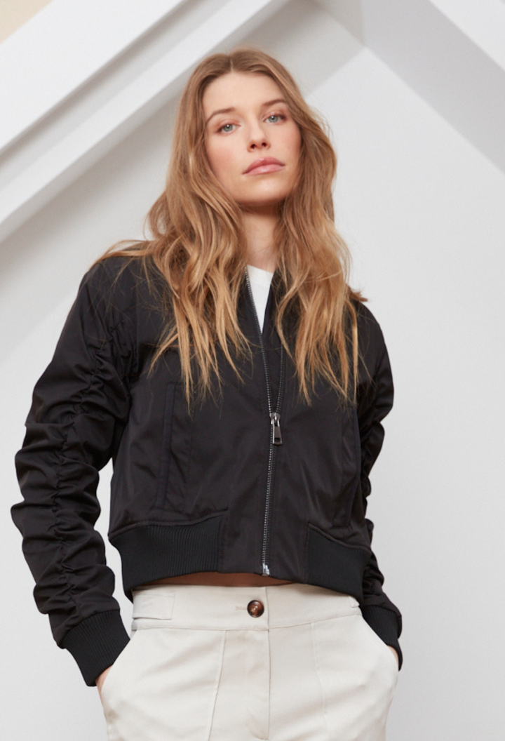 Adroit Atelier Cierra Bomber Jacket With Shirring Detail in Black available at Barbara Katz