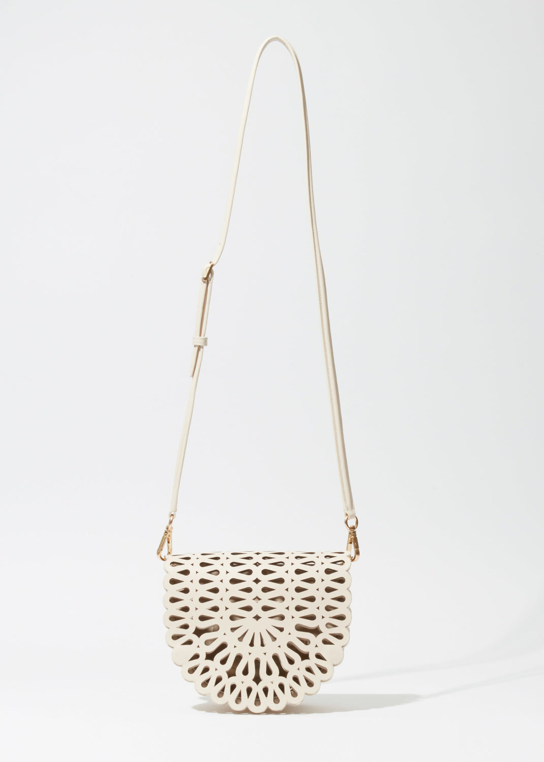 Simkhai Mccall Laser-Cut Leather Saddle Bag in Cream available at Barbara Katz