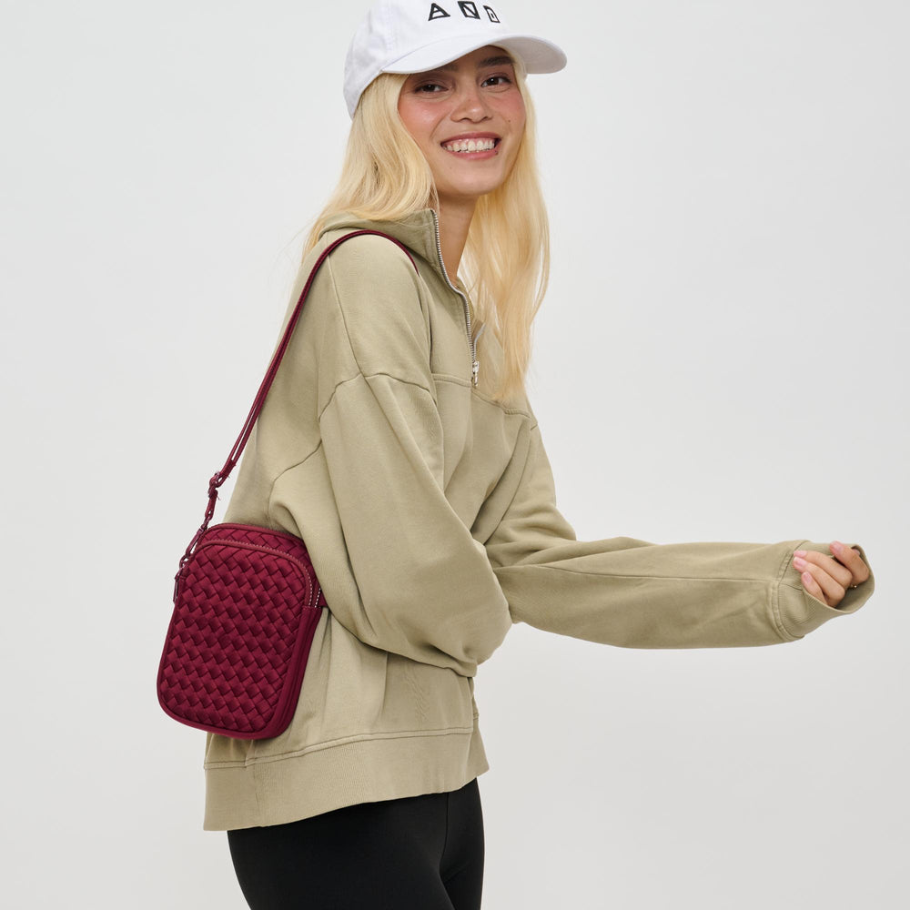 Sol and Selene Divide & Conquer Woven Crossbody Bag in Wine available at Barbara Katz