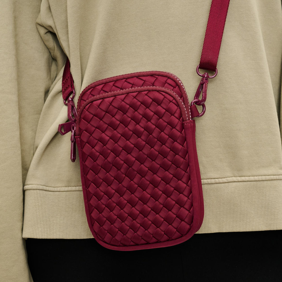 Sol and Selene Divide & Conquer Woven Crossbody Bag in Wine available at Barbara Katz