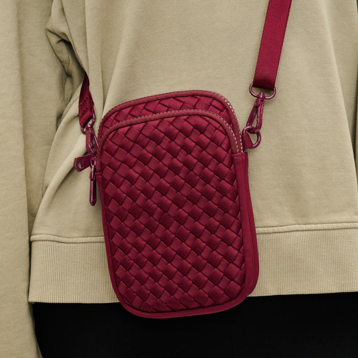 Sol and Selene Divide & Conquer Woven Crossbody Bag in Wine available at Barbara Katz
