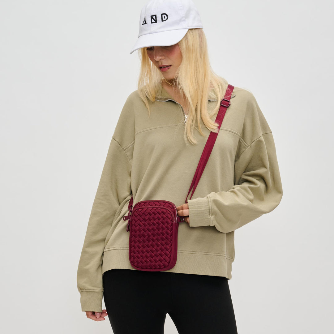 Sol and Selene Divide & Conquer Woven Crossbody Bag in Wine available at Barbara Katz