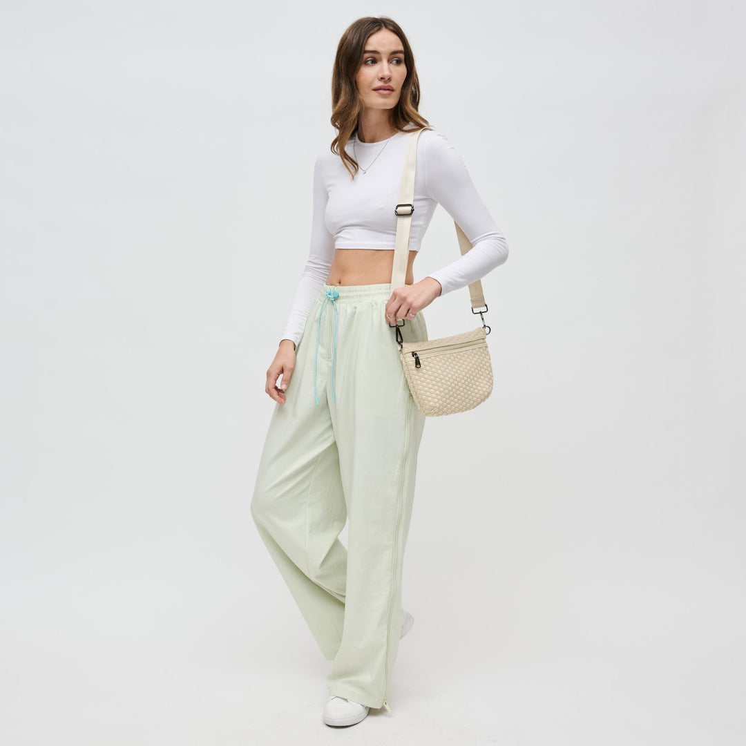 Sol and Selene Ethereal Woven Neoprene Crossbody Bag in Cream available at Barbara Katz