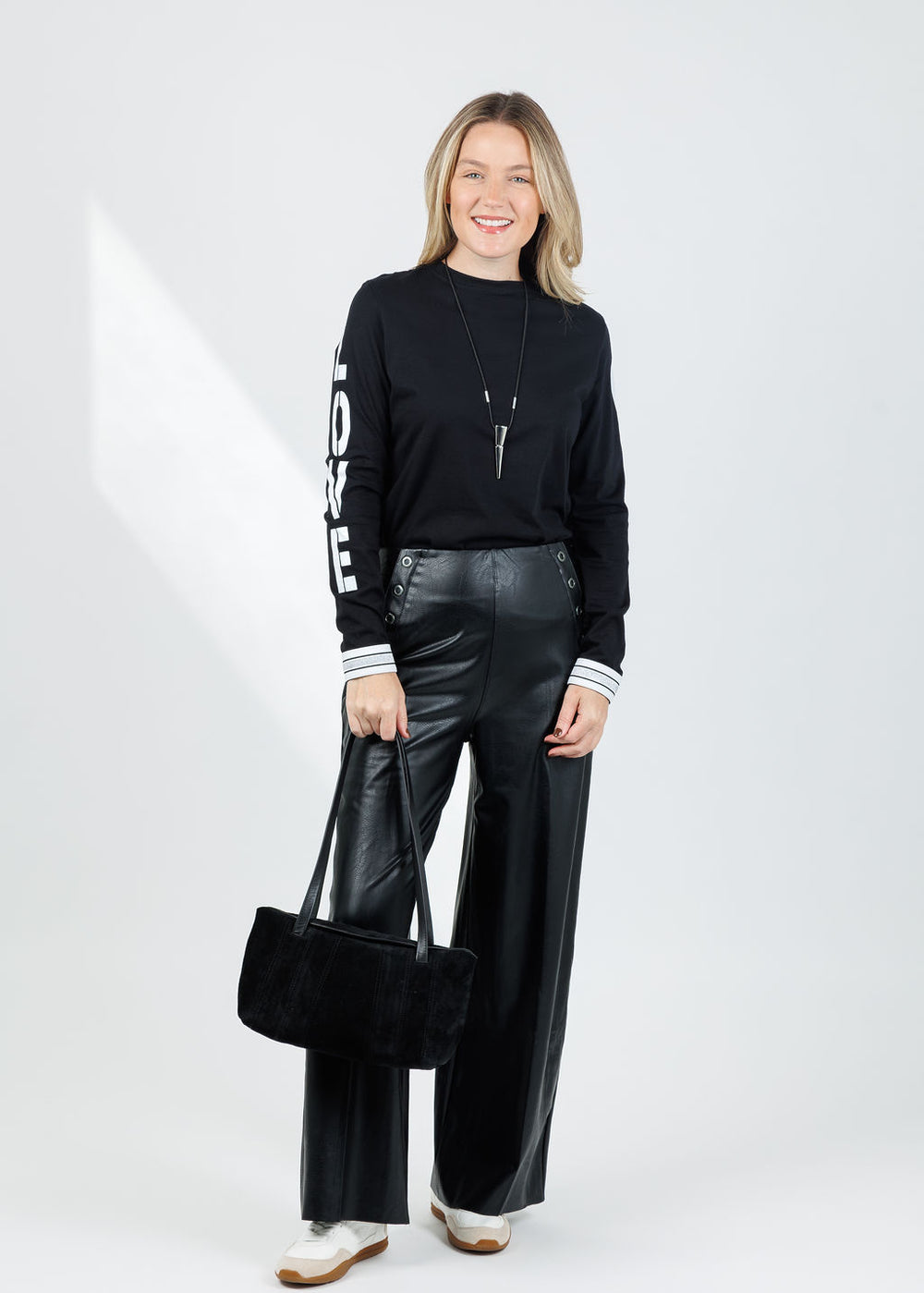 Suzy T Amelia Love Long Sleeve Top in Black available at Barbara Katz