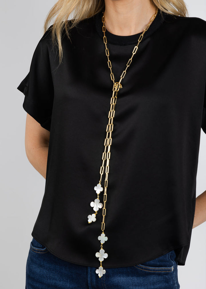 Suzy T Clover Lariat Necklace in Gold available at Barbara Katz