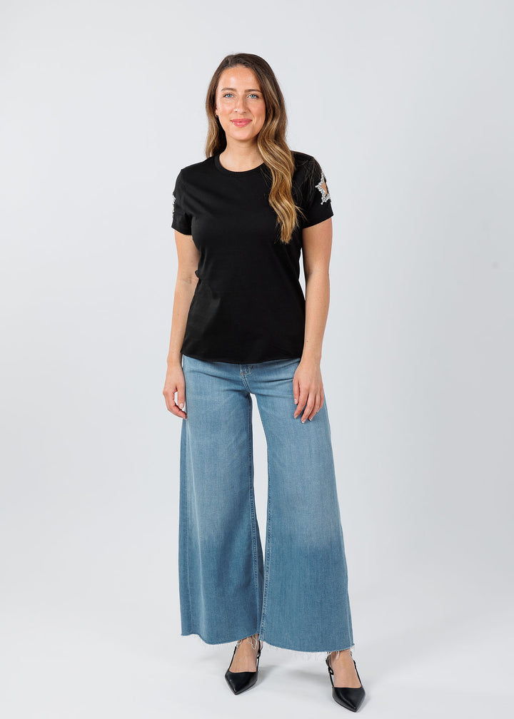 Suzy T Stars Cut Out Sleeve Top in Black paired with Citiznes of Humanity Lyra Crop Wide Leg Jeans in Bhodi available at Barbara Katz