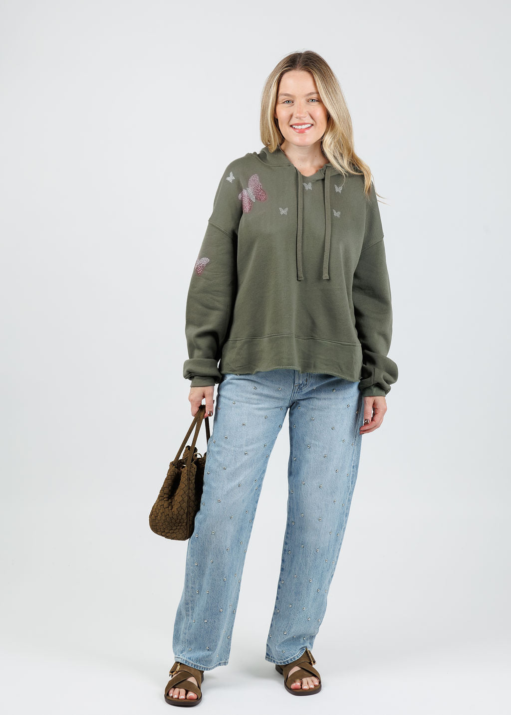 Suzy T Samy Pink Butterflies Hoodie in Olive paired with Pistola Lexi Mid Rise Bowed Straight Jeans in Aries available at Barbara Katz