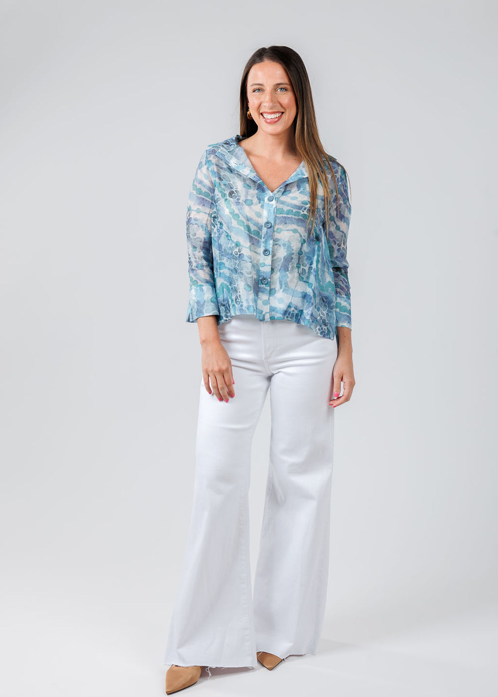 Terra Irina Sheer Shirt in Blue Lagoon paired with Pistola Izzy Mid Rise Wide Leg Crop Jeans in Vivid White available at Barbara Katz