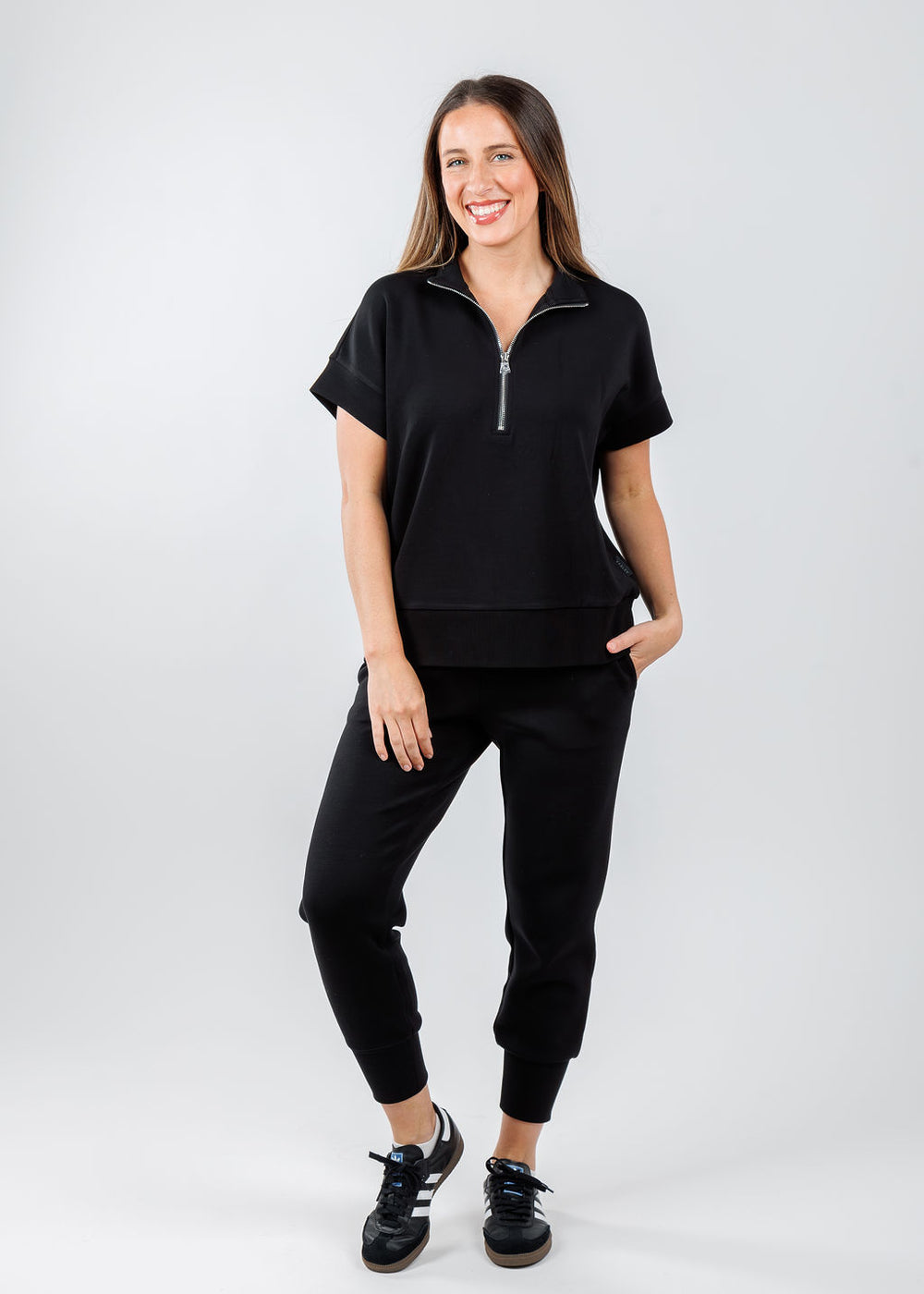 Varley Ritchie Short Sleeve Sweatshirt in Black paired with Varley The Slim Cuff Pants 25" in Black available at Barbara Katz 
