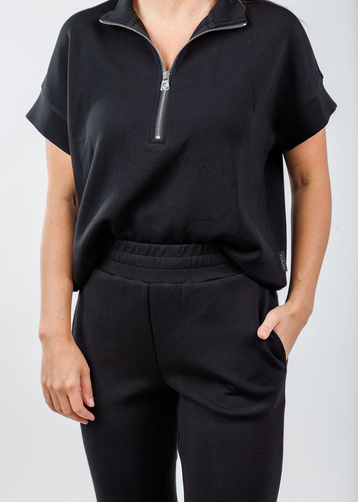 Varley Ritchie Short Sleeve Sweatshirt in Black paired with Varley The Slim Cuff Pants 25" in Black available at Barbara Katz 