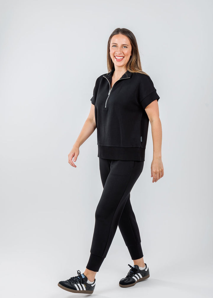 Varley The Slim Cuff Pants 25" in Black paired with Varley Ritchie Short Sleeve Sweatshirt in Black available at Barbara Katz 