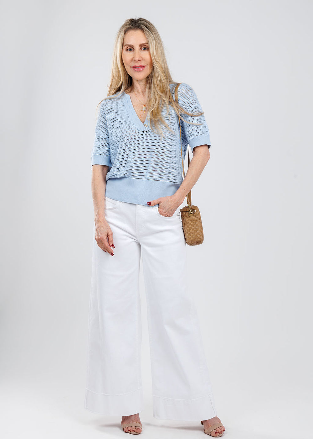 Varley Callie Knit Top in Cashmere Blue paired with MAC Nevada Superwide Jeans in White, Clare V Midi Sac Crossbody Bag in Clay Leather & Suede Woven Checker available at Barbara Katz