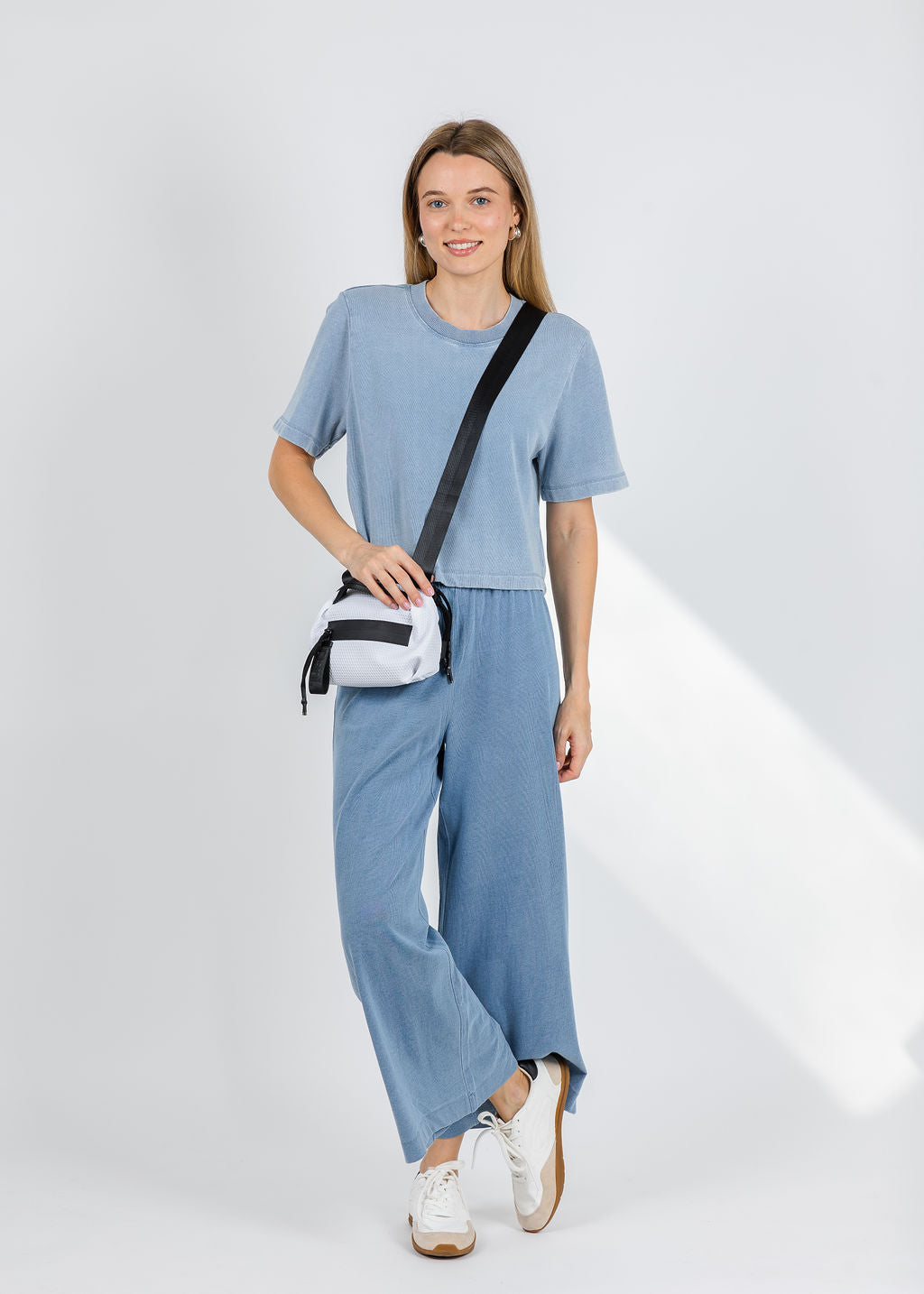 Z Supply Curran Knit Denim Sweatshirt in Ocean Air Indigo paired with Z Supply Scout Jersey Denim Pants in Santorini Indigo available at Barbara Katz