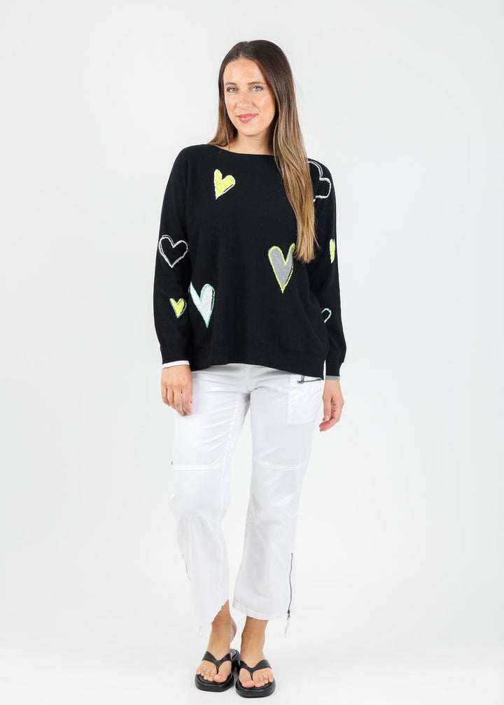 Zaket & Plover Heart Pattern Sweater in Black paired with Marrakech Cyprus Pants in White available at Barbara Katz