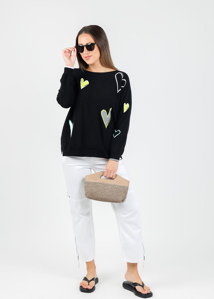 Zaket & Plover Heart Pattern Sweater in Black paired with Marrakech Cyprus Pants in White available at Barbara Katz