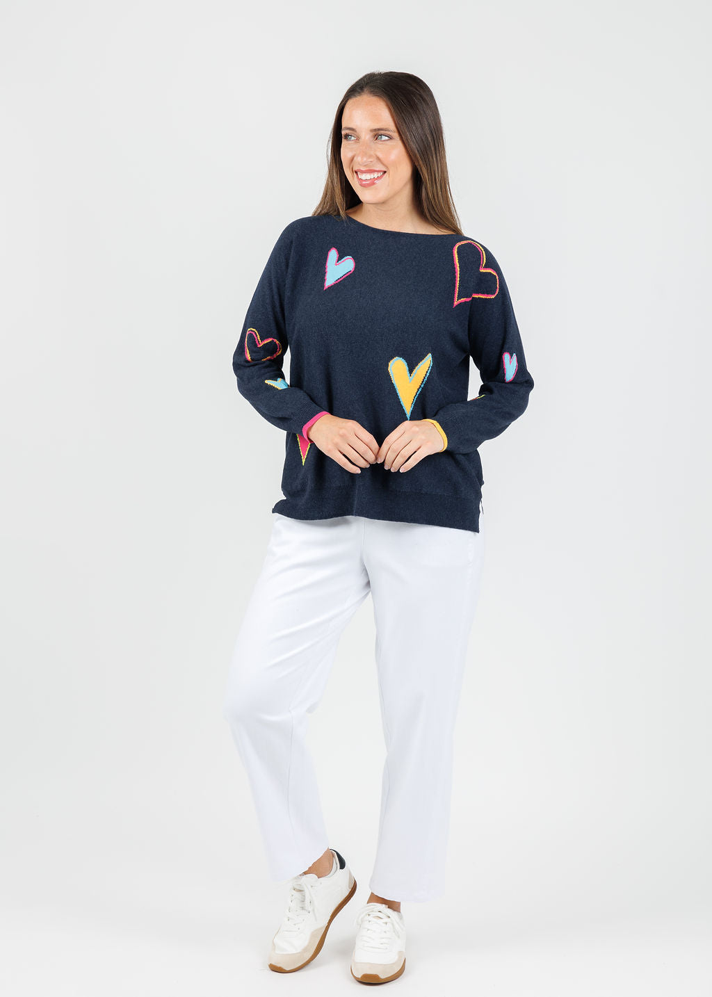 Zaket & Plover Heart Pattern Sweater in Dark Denim paired with White Pants available at Barbara Katz