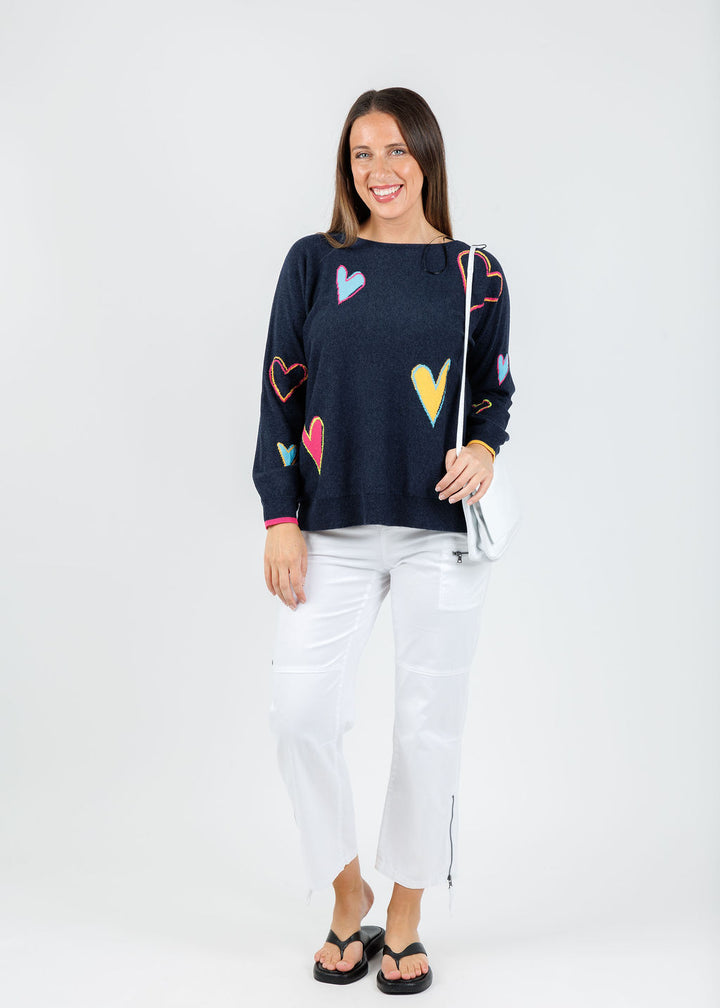 Zaket & Plover Heart Pattern Sweater in Dark Denim paired with Marrakech Cyprus Pants in White available at Barbara Katz