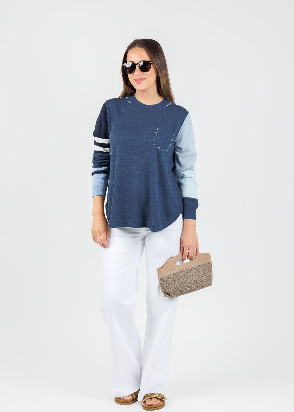 Zaket & Plover Mia Stitch Pocket Sweater in Denim paired with White Pants available at Barbara Katz