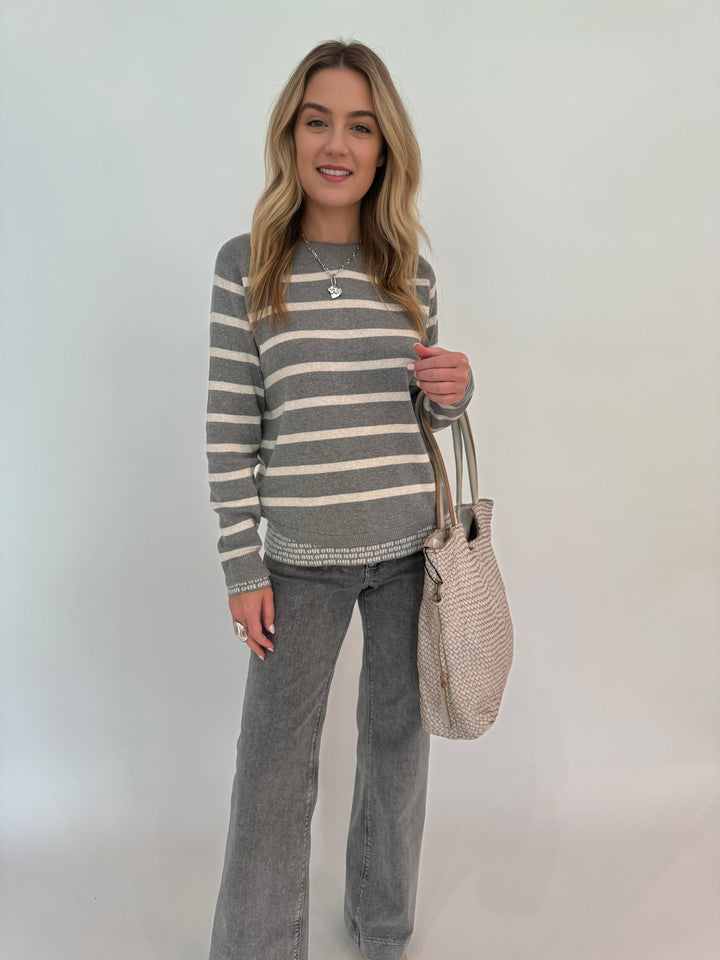 Oui Stripe Double Layer Sweater in Grey/White paired with MAC Dream Boot Jeans in Metallic Silver, bag BK Intrecciato Tote in Beige, all available at barbarakatz.com