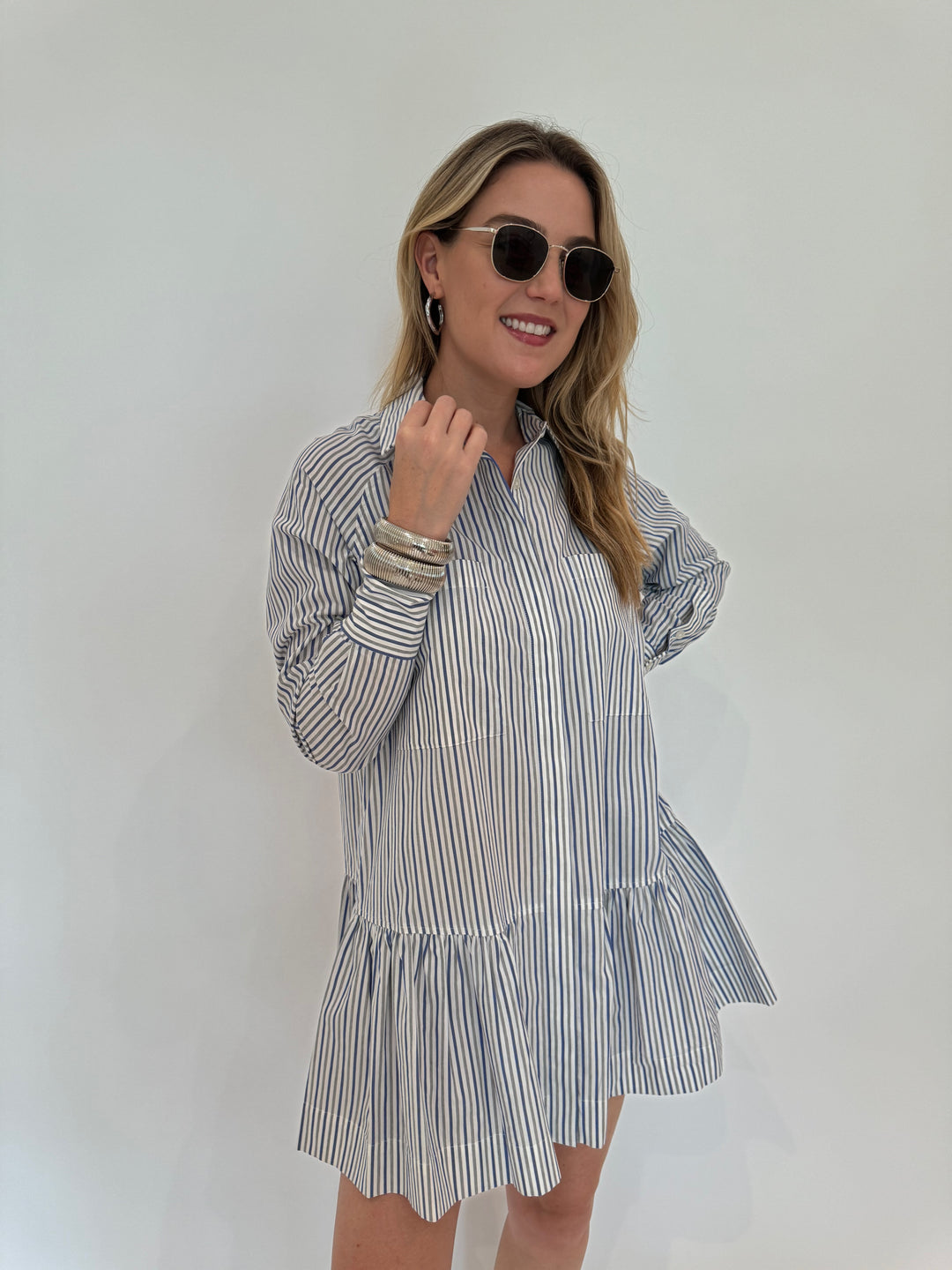 Simkhai Polina Shirt Mini Dress - Cool Gray Stripe with Le Specs Neptune Deux Sunglasses, Alexis Bittar Brut Tube Hoop Earrings in Silver, BK Silver Cobra Cuff and Bracelet - all available at Barbara Katz