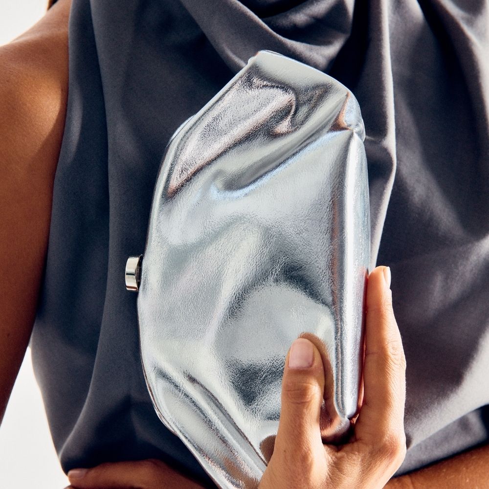 Olga Berg Tally Metallic Clutch in Silver available at Barbara Katz