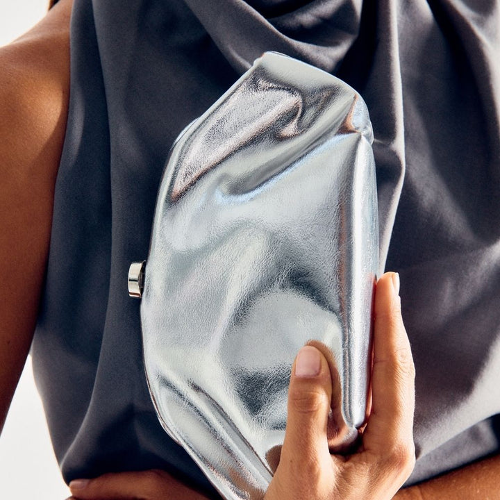 Olga Berg Tally Metallic Clutch in Silver available at Barbara Katz