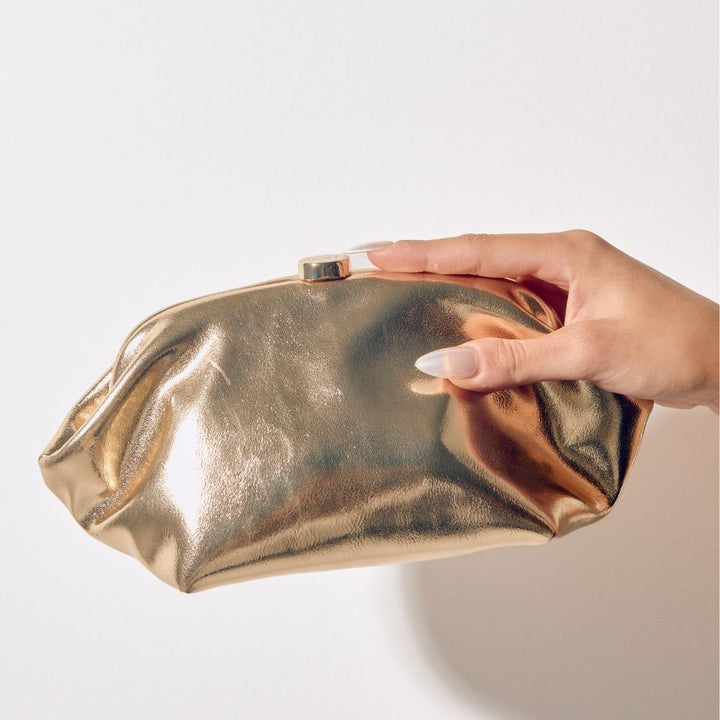 Olga Berg Tally Metallic Clutch in Gold available at Barbara Katz