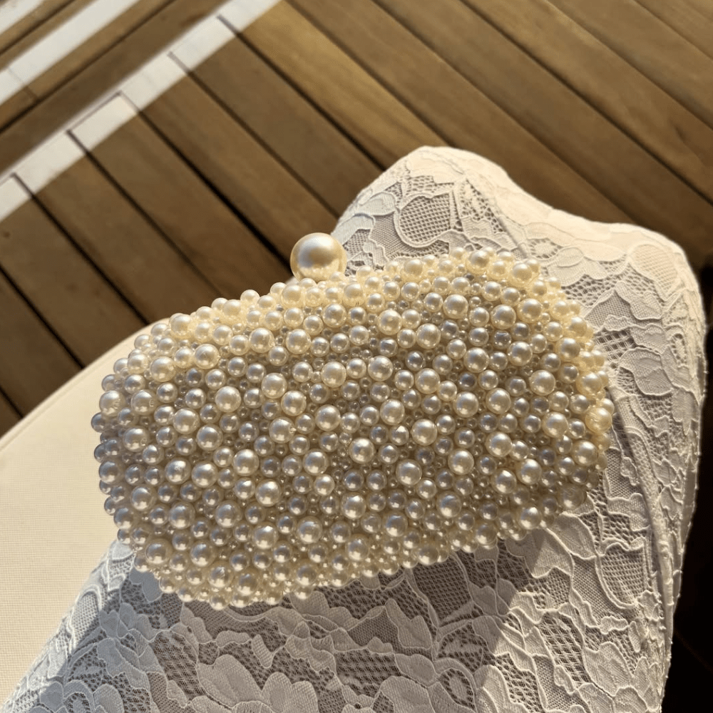 Olga Berg Valentina Pearl Clutch Bag in Pearl/Silver available at Barbara Katz