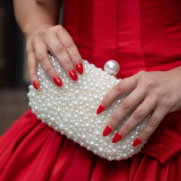 Olga Berg Valentina Pearl Clutch Bag in Pearl/Silver available at Barbara Katz